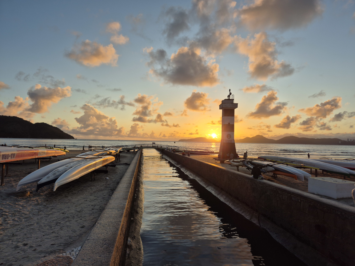 Lighthouse and Outrigger Canoes